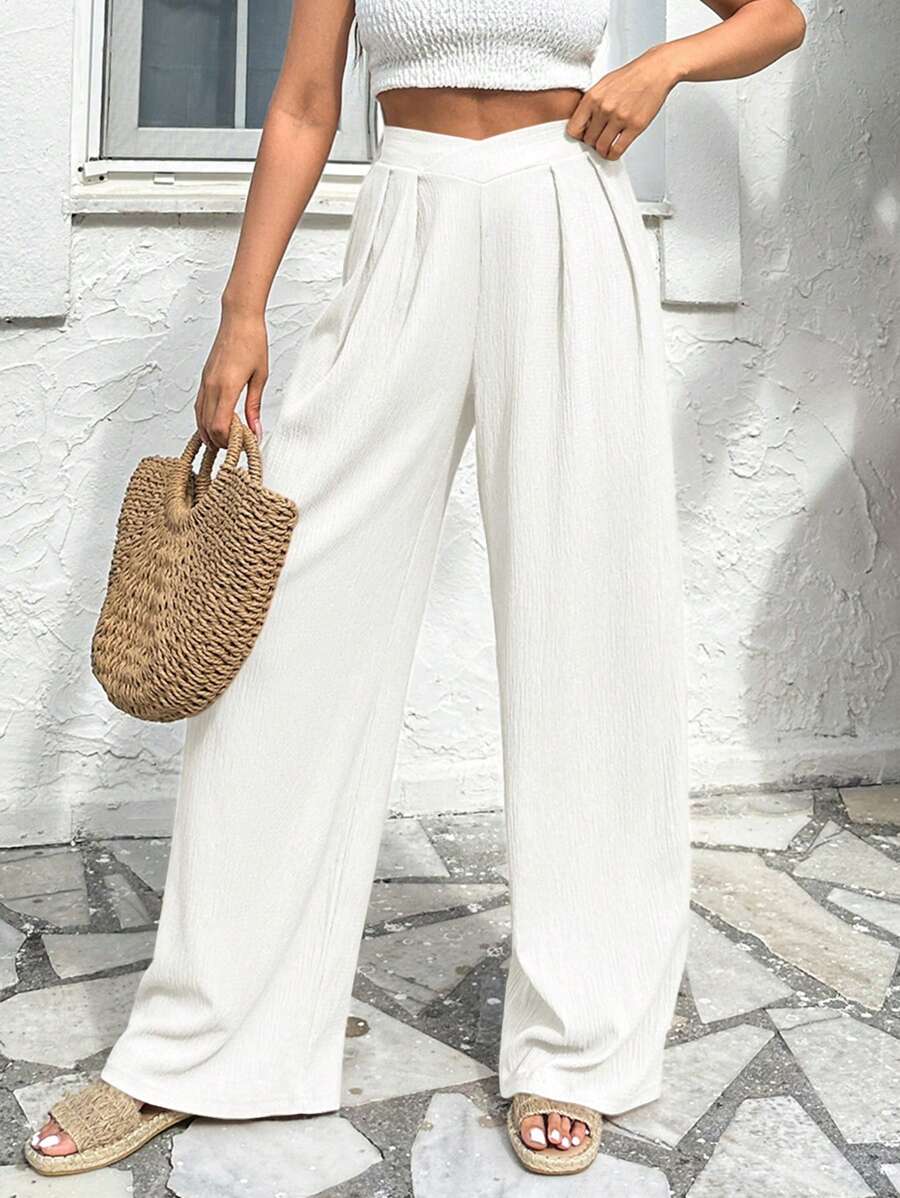 Stilrena byxor med asymmetrisk midja