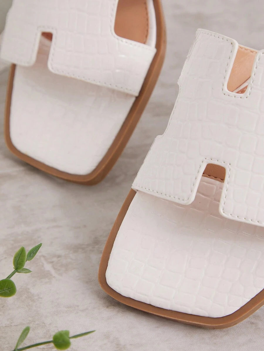 Luxe-inspirerade vita slides med sele