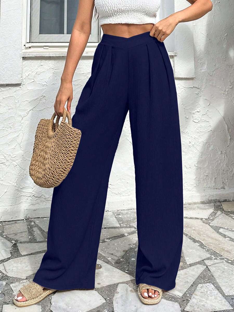 Stilrena byxor med asymmetrisk midja